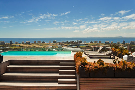 Sunny, modern rooftop swimming pool with ocean view, Cape Town, South Africa