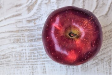 red apple on a wooden background