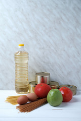 Food donation concept, set of products on white wooden background