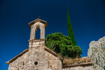 Facade of the old Church of St. George near Kotor in Montenegro. Ancient Serbian church. Old...