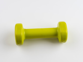 A small green dumbbell on white background