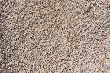 Background with small yellow stones. Stone for construction. Building material. Texture background.