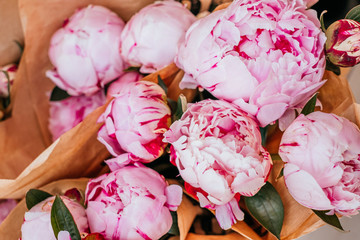 Beautiful pink peony flowers bouquet on flower market
