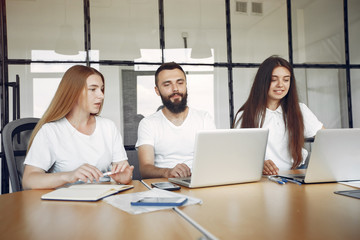 Students create a new project. Team working in a office