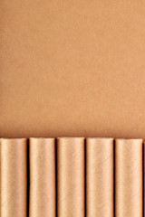 Disposable tableware made of environmental materials. Eco-friendly cookware, zero waste production from recycled materials. Paper plates, glasses, cocktail tubes. Wooden forks and knives. 