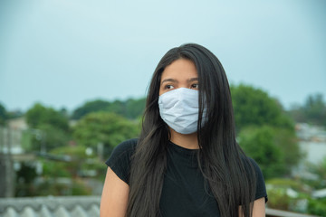 Latin American girl wearing surgical mask