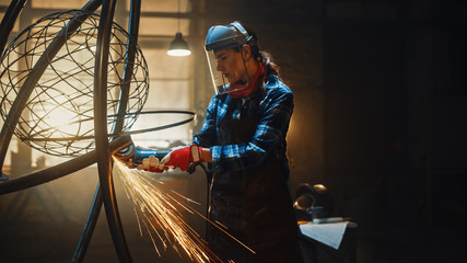 Beautiful Female Artist Uses an Angle Grinder to Make Brutal Metal Sculpture in Studio. Tomboy Girl...