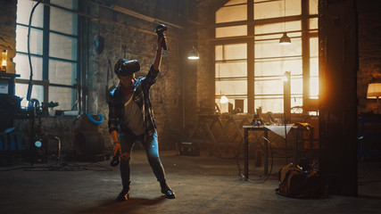 Talented Female Artist Wearing Virtual Reality Headset and Holding Digital Joysticks. She's Working on a Painting or Sculpture, Uses Motion Controllers To Create Concept Art. Creative Modern Studio.