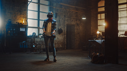 Naklejka na ściany i meble Talented Female Artist Wearing Virtual Reality Headset and Holding Digital Joysticks. She's Working on a Painting or Sculpture, Uses Motion Controllers To Create Concept Art. Creative Modern Studio.