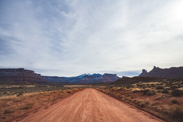 Unpaved road at Arches National Park when Sun is rising