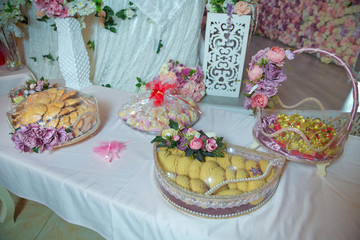 Basket with sweets stands on the table . Engagement basket .