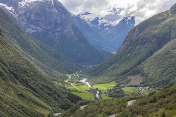 Aerial summer view of green valley in mountains in Norway selective focus