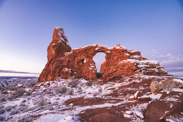 Turret Arch at Arches National Park in snow when sun is rising. © KIRARA