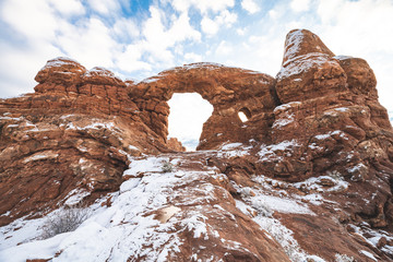 Turret Arch at Arches National Park in snow when sun is rising. © KIRARA