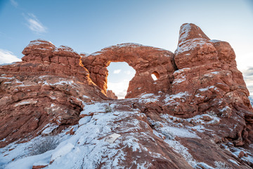 Turret Arch at Arches National Park in snow when sun is rising. © KIRARA