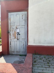 red door in a brick wall