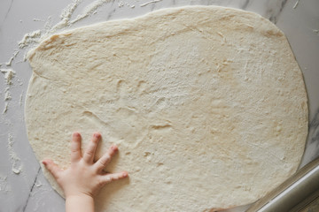 dough and kid's hand