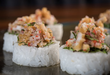 Three maki rolls in a row with salmon, eel and cucumber isolated on white background. Fresh...