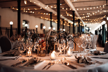 photo of a wedding location with dinner tables - obrazy, fototapety, plakaty