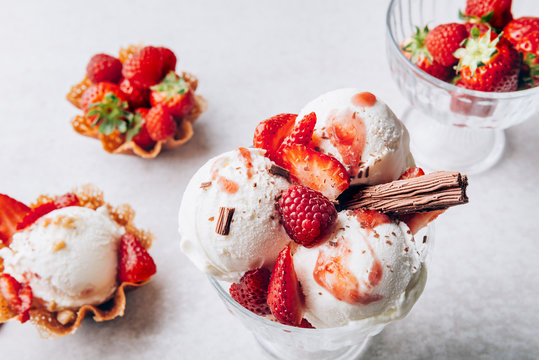 Vanilla Ice Cream Scoops with strawberry pieces, easy dessert at home