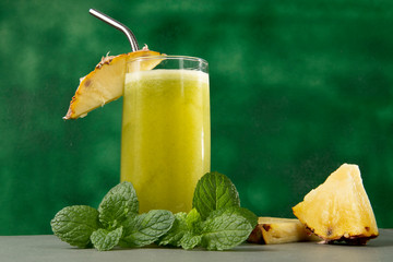 glass cup with pineapple juice and mint