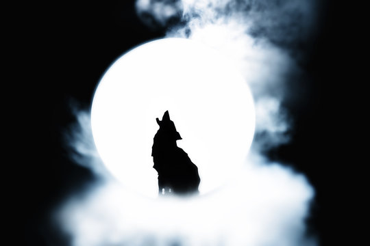 Silhouette of wolf howling at the full moon with white smoke