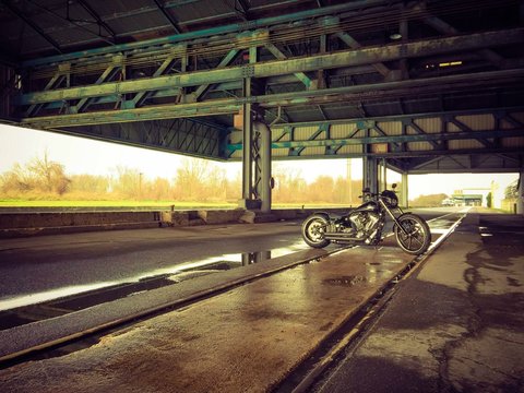 Motorcycle At Wet Parking Lot