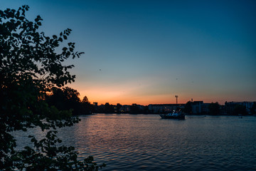 Naklejka premium photo of a landscape of a lake at sunset