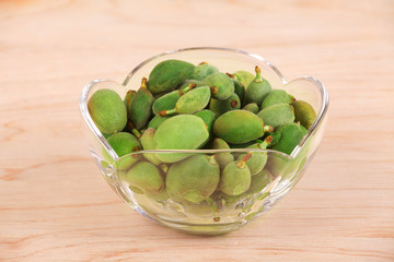 Green almonds green apricot, sour fruit.