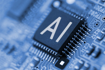 Close- up of computer chip with AI sign. Artificial intelligence.