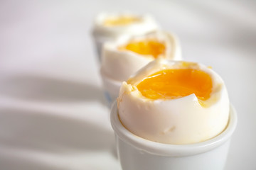 three boiled eggs close up on a white background