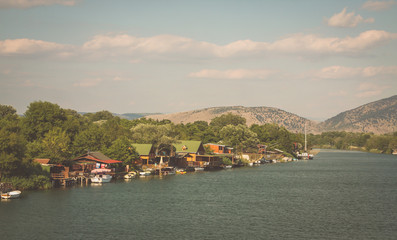 Restaurants and other houses on the beach of Ada Bojana in Montenegro, close to Ulcinj, on the border with Albania