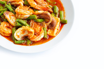 Spicy stir fried seafood and yard long bean with red curry paste. Thai food