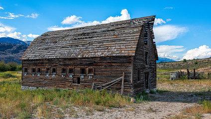 An old abandoned wooden barn in the fields in the Okanagan valley Canada