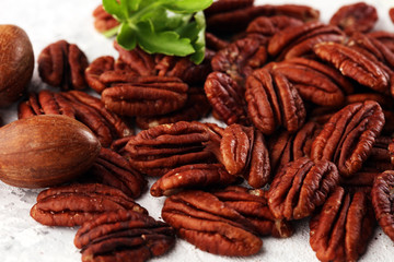 Tasty Pecan nuts on a rustic table.