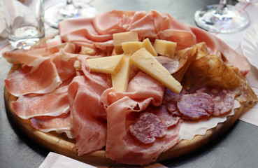Typical Italia food in Bologna - cheese, salami and ham