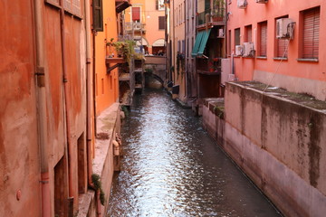 River in Bologna downtown near red houses