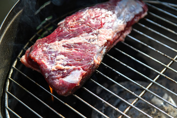 Rump skirt on grill. Selective focus.