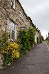 Fototapeta na wymiar Houses on the High Street in Burford in Oxfordshire, UK