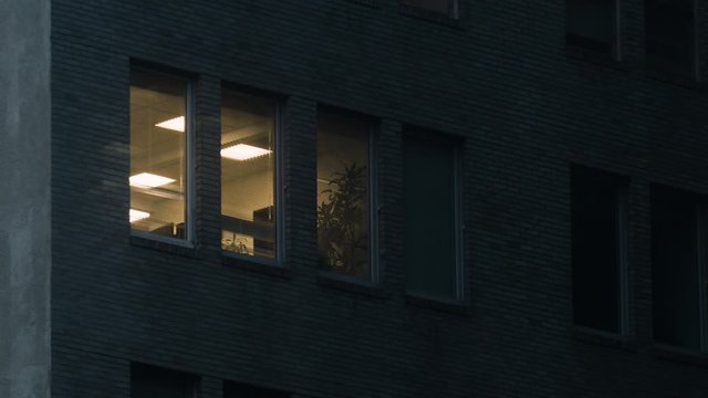 Apartment window at night in the rain