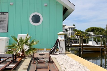 Teal shed on tropical Marina