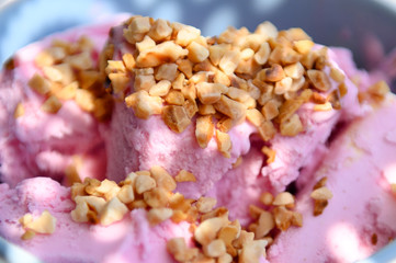 Strawberry ice cream with nuts. The taste of summer.
