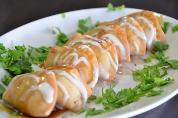 food on plate with green leaf