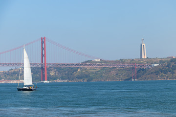 Sailboat with 25th April bridge  in the background