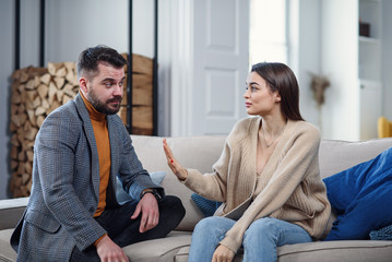 Difficulties, conflict and family concept - unhappy couple having arguing at home.