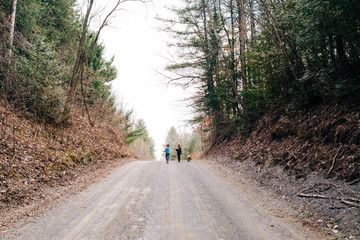 kids walking along dirt road