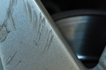 Car wheel scratch damage. Insurance and car rental themes