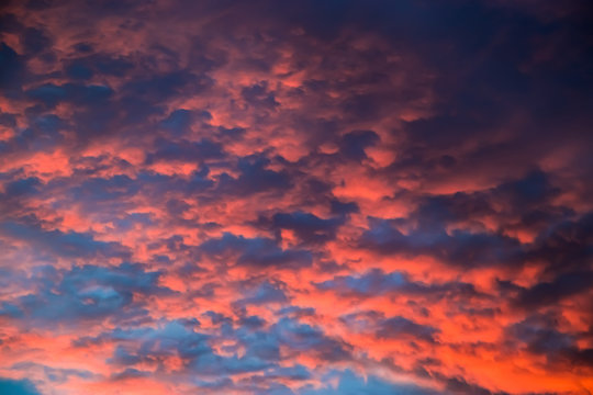 Beautiful sky at sunset. Purple and pink unusual clouds. Blurred background for design. © Galina Atroshchenko