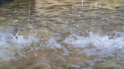 Close up view of water falling down in day light.