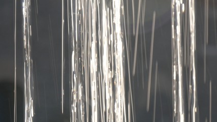 Close up view of water falling down in day light.